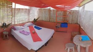 Postel nebo postele na pokoji v ubytování Tortuga B&B