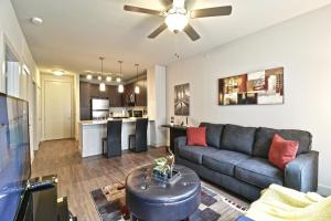 a living room with a couch and a table at GA Living Suites - Knox District Uptown Dallas in Dallas