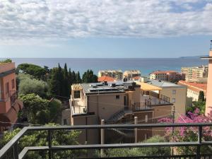a large building with a view of the ocean at Gioia Bed and Breakfast in Finale Ligure