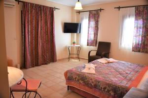 Postel nebo postele na pokoji v ubytování Melidron Hotel