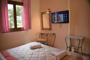 Postel nebo postele na pokoji v ubytování Melidron Hotel