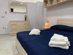 Ένα ή περισσότερα κρεβάτια σε δωμάτιο στο B&B La Corte