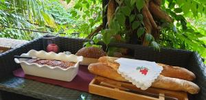 a tray with bread and other foods on a table at La Cordeline in Brignoles