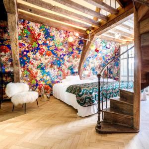 Un ou plusieurs lits dans un hébergement de l'établissement Small Luxury Hotel De Witte Lelie