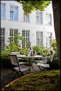 Jardin de l'établissement Small Luxury Hotel De Witte Lelie