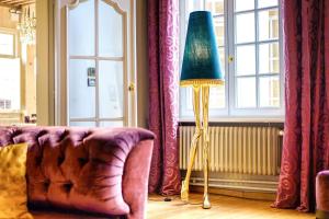 Coin salon dans l'établissement Small Luxury Hotel De Witte Lelie