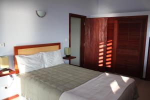 Postel nebo postele na pokoji v ubytování Bularangi Villa, Fiji