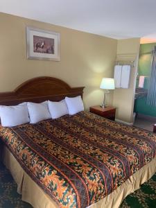 Ένα ή περισσότερα κρεβάτια σε δωμάτιο στο Mt. Vernon Motel