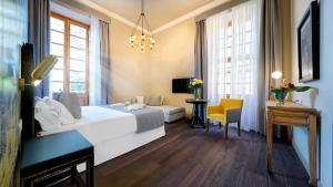 Postel nebo postele na pokoji v ubytování Hotel Emblemático Agáldar + 36 fotografií