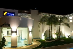 a building with a sign on the side of it at Ganimede Hotel in Sperlonga