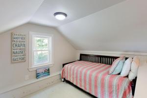 a bedroom with a bed and a window at Wendell K. Backus House in Cotuit