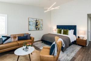 a living room with a bed and a couch at Olea Hotel in Glen Ellen