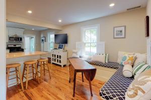 a kitchen and living room with a couch and a table at Wendell K. Backus House in Cotuit +16 photos