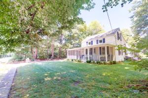 an old white house with a large yard at Wendell K. Backus House in Cotuit