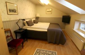 Säng eller sängar i ett rum på Filipsborg, the Arctic Mansion