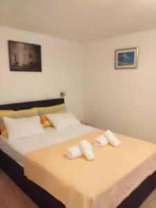 Postel nebo postele na pokoji v ubytování Apartments & room Ivica Split