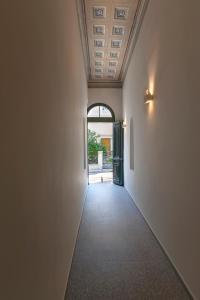 an empty hallway with a ceiling and a door at Noma Hotel in Athens