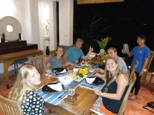 a group of people sitting around a table at Villa Sebali in Ubud