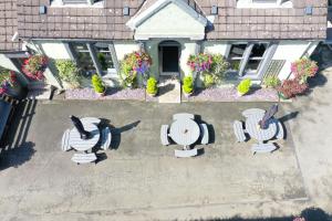 an overhead view of a patio with chairs and flowers at Auld Mill House Hotel in Dunfermline