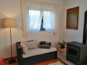 a living room with a couch and a window at Casas de Alvite in Cerva