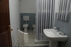 a bathroom with a sink and a toilet at B&b Al Centro Nicosia in Nicosia