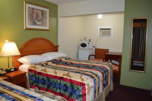 Posteľ alebo postele v izbe v ubytovaní Lincoln Motel