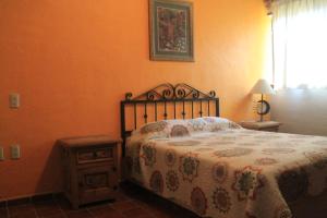 Postel nebo postele na pokoji v ubytování Quinta Comala Hotel & Villas