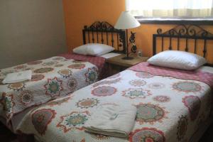 Postel nebo postele na pokoji v ubytování Quinta Comala Hotel & Villas