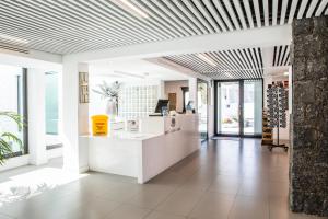 a lobby of a store with a white counter at Bahia Calma Beach in Costa Calma