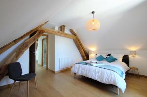 
A bed or beds in a room at La Villa Lombardi
