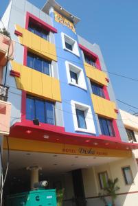 a hotel building with colorful windows at Hotel Disha Palace in Shirdi