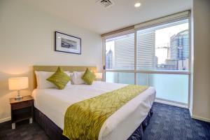 Cama ou camas em um quarto em The Quadrant Hotel & Suites mais 37 fotos
