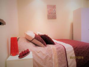 a bedroom with a bed with red shoes on it at Star Studio Gauthier in Casablanca