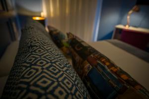 a close up of a pillow on a bed at ZIGZAG HOSTEL in Praia da Vitória