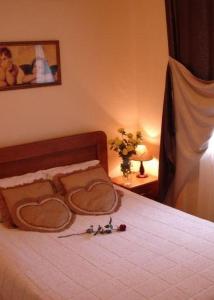a bedroom with a bed with two hearts on it at Sinay Hotel in Poltava