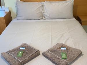 Кровать или кровати в номере Lemontree Cottage