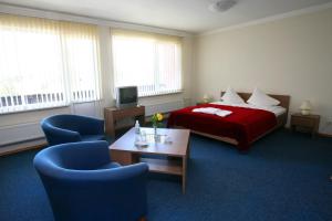Кровать или кровати в номере Hotel Dobele