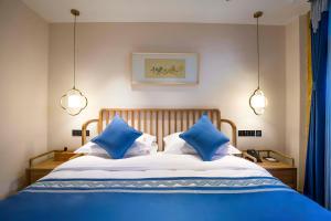 Letto o letti in una camera di Beijing Heyuan Courtyard Hotel (Forbidden City)
