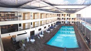 an overhead view of the pool of a hotel at La Primera Grande Beach Resort in Roxas