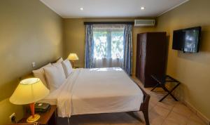 TV a/nebo společenská místnost v ubytování Berjaya Praslin Resort