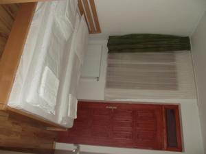 Postel nebo postele na pokoji v ubytování Sárkány Apartman, Sárkány Wellness és Gyógyfürdő