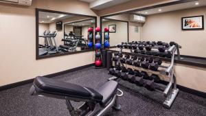 a gym with tread machines and mirrors at Best Western Braintree Inn in Braintree