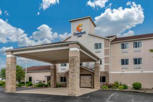 a rendering of a hotel with a building at Comfort Inn Warren I-69 in Warren