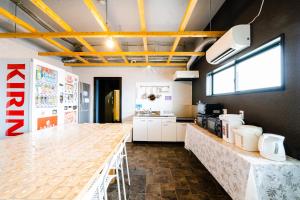 a kitchen with a long counter in a room at Hotel Pagoda in Nara