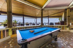 a pool table in the middle of a room at Coral View Resort in Ko Tao