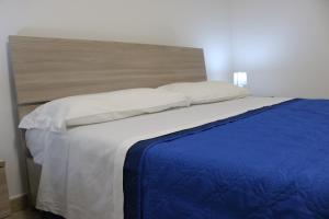 A bed or beds in a room at Atmosphera Casarano