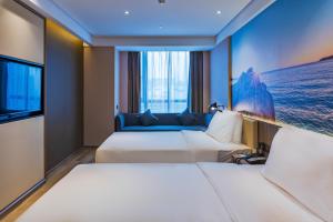 Postel nebo postele na pokoji v ubytování Atour Hotel (Wenzhou International Airport Olympic Sports Center)