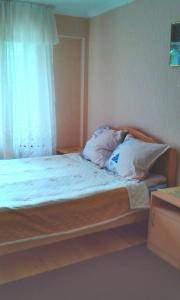 Una cama o camas en una habitación de Guesthouse Valeria