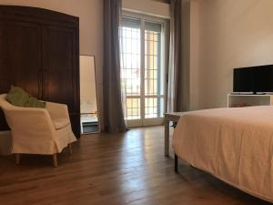 TV a/nebo společenská místnost v ubytování Pisacane61 B&B