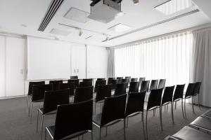 a conference room with black chairs and white walls at Aimia Hotel in Port de Soller +39 photos